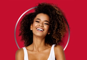 Women laughing with curly hair